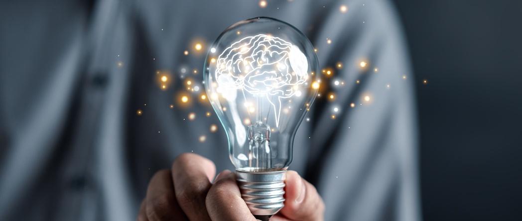 Hand holding lightbulb start new idea and learning educate and graduation concept.