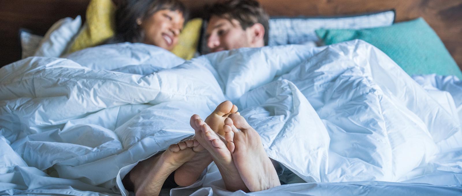 Couple in bed post sex