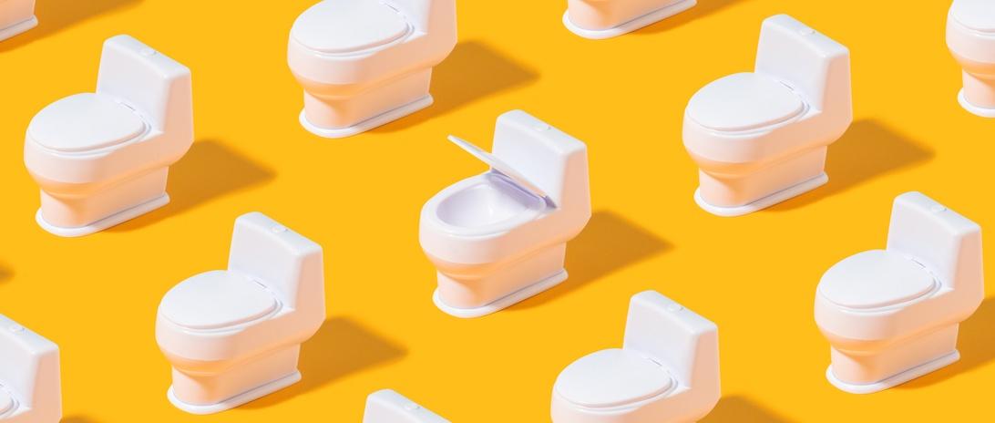 Trendy pattern with white toilet bowl on bright orange background.